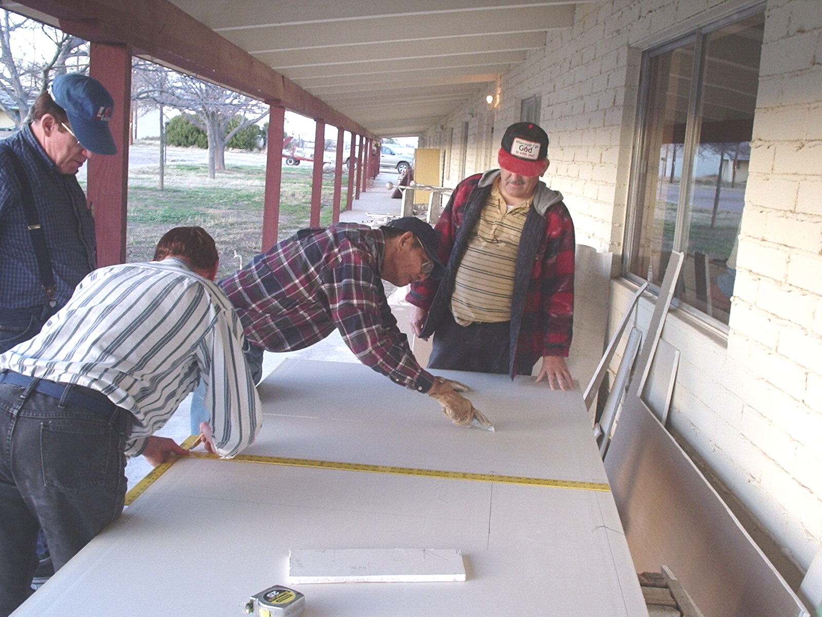 Volunteers Cutting Drywall